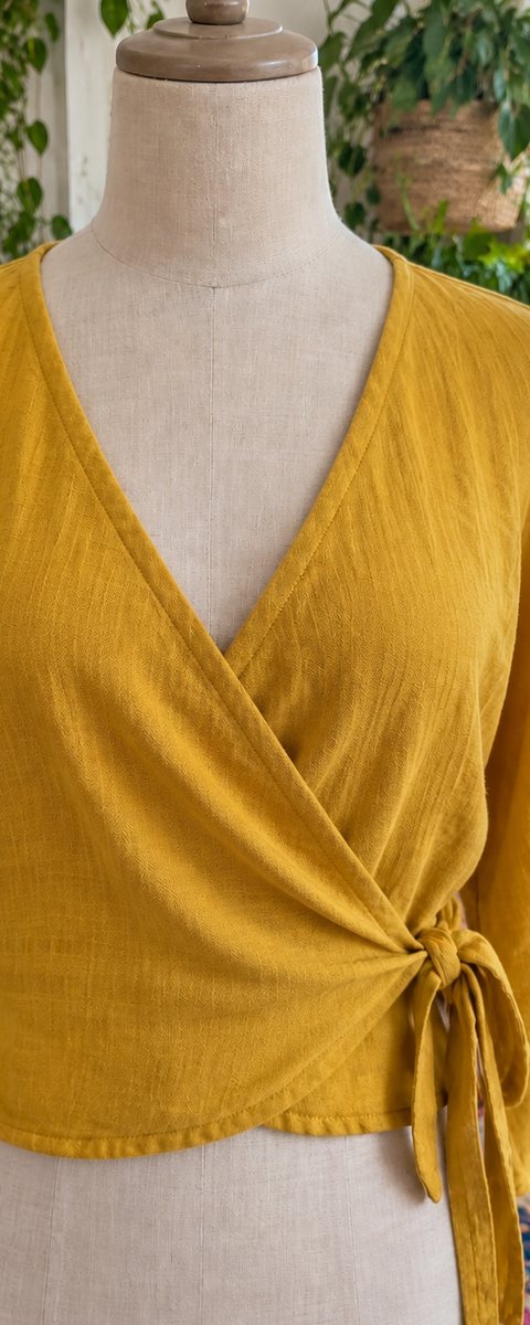 After: the wrap top neckline held in place